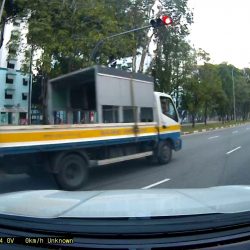 Unable to see clearly. Please assist if possible Lorry beats red-light in T-Junction.