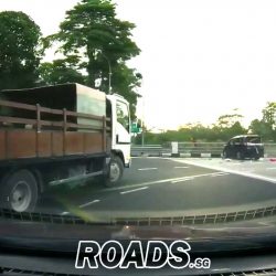 MPV runs red light, hits taxi then flips over