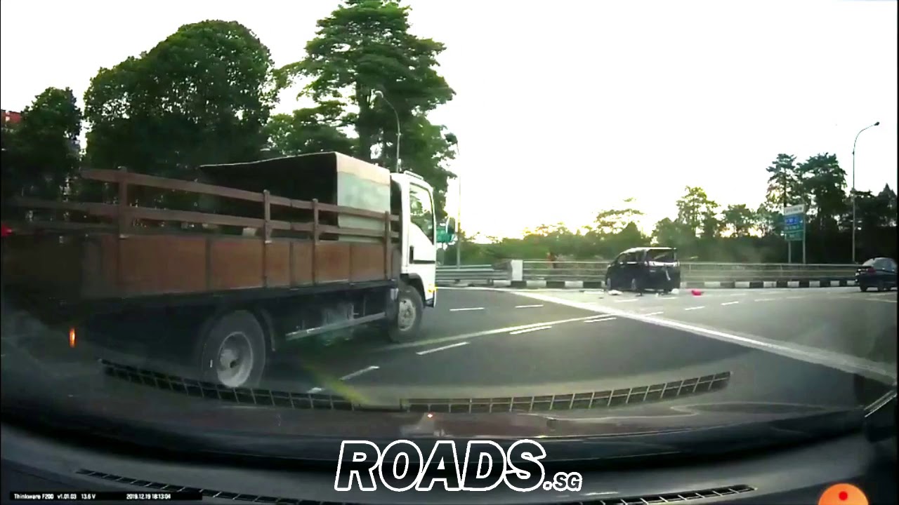 MPV runs red light, hits taxi then flips over