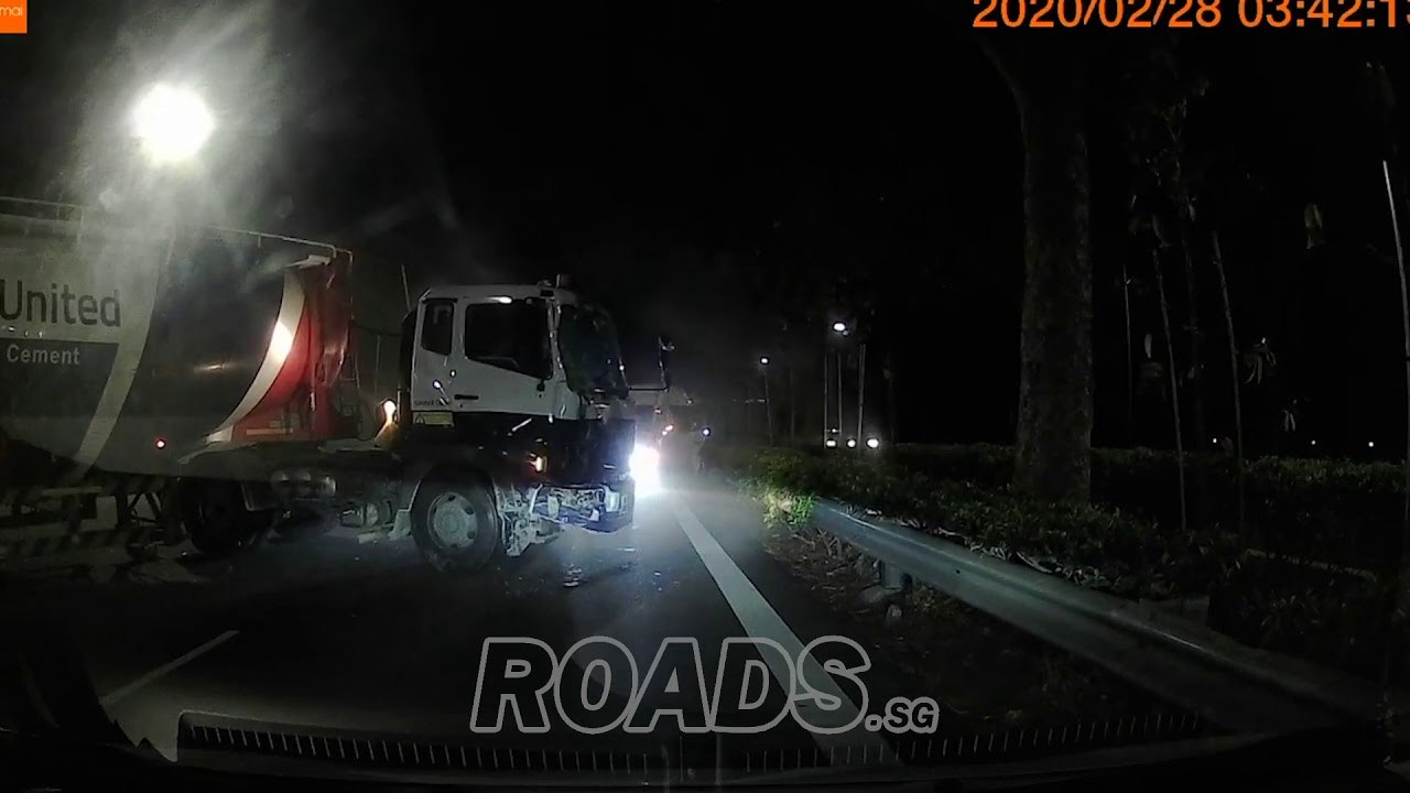 Cement truck jack knifed after hitting private mini bus