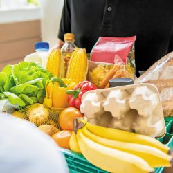 Delivery man delivering food to customer at home