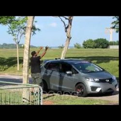 Man blasting EDM music from his car and dancing to it