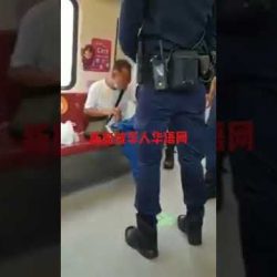 Man not wearing mask and talking on phone on MRT gets confronted by the police