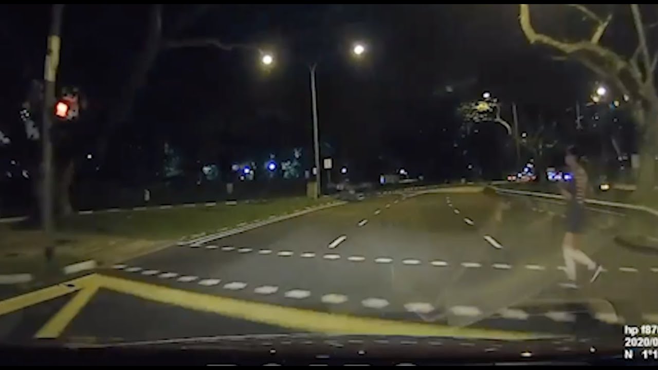 Jogger wearing dark clothes dashed across junction and had a close shave with cam-car