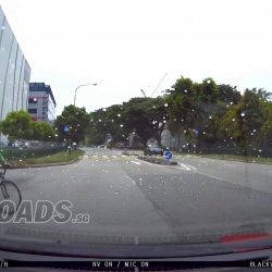 GrabFood cyclist does not check before turning almost causing accident