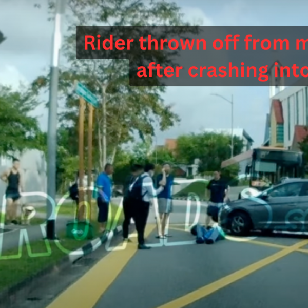 Rider thrown off from motorcycle after crashing into car